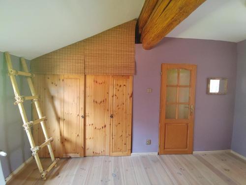 a room with two doors and a ladder at West Bohemian Home, Krajkova 208 in Krajková