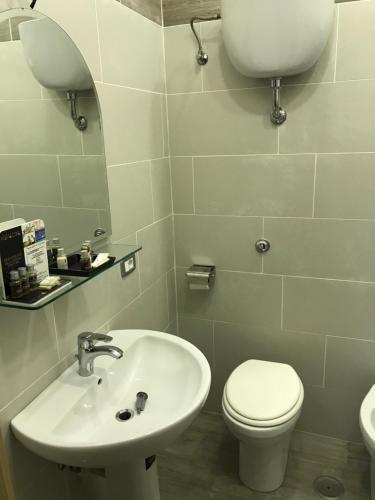 a bathroom with a sink and a toilet at Villa Scotillo Boutique Hotel in Agropoli