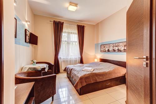 Łóżko lub łóżka w pokoju w obiekcie Villa Porto