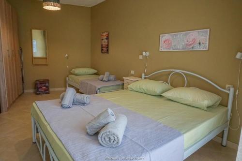 A bed or beds in a room at SUNDAY MEMORIES