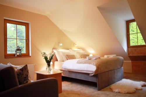 a bedroom with a king sized bed in a attic at Penzion Bawaria in Horní Lomná