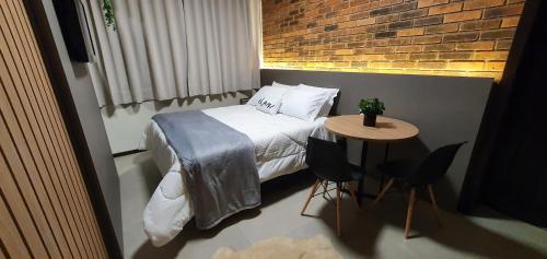 Postel nebo postele na pokoji v ubytování Malbec Casa Hotel