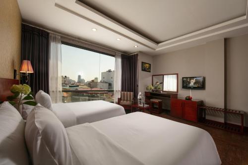 Giường trong phòng chung tại Sen Hotel - Managed by Sen Hotel Group