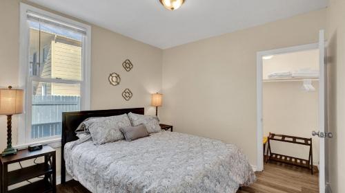 a bedroom with a bed and a large window at Escape to Serenity in Colorado Springs