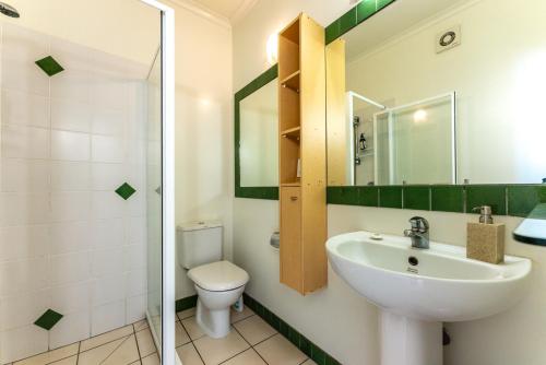 a bathroom with a sink and a toilet at Villa Sapphire at Palm Beach in Palm Beach