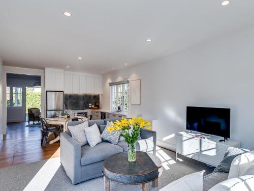 a living room with a couch and a table at Gem on Gillean - Havelock North Holiday Home in Havelock North