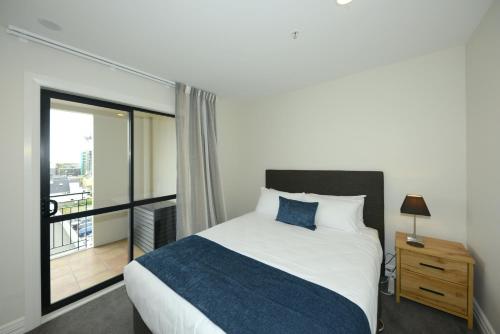 Ένα ή περισσότερα κρεβάτια σε δωμάτιο στο West Fitzroy Apartments
