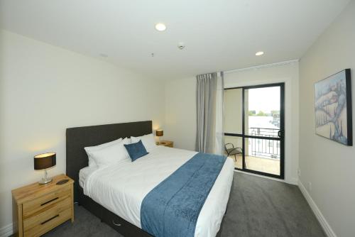 Ένα ή περισσότερα κρεβάτια σε δωμάτιο στο West Fitzroy Apartments