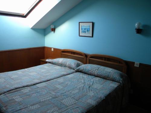 Postel nebo postele na pokoji v ubytování Hotel Solymar