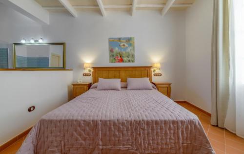 a bedroom with a large bed in a room at Seranova Luxury Hotel - Adults Only in Ciutadella