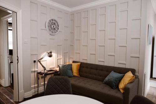 a living room with a couch and a table at Kilmore Guesthouse in Kilkenny