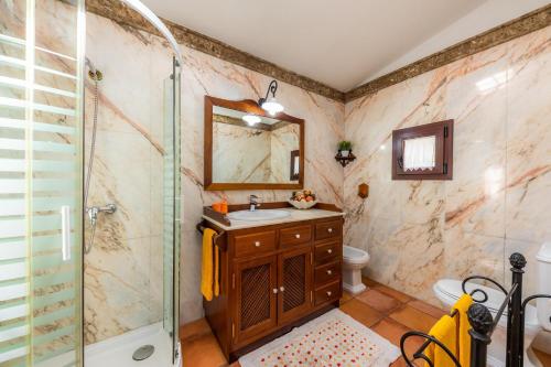 a bathroom with a sink and a shower at Es Voltor in Artá