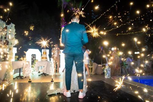 a man standing on a stage with lights at Larnaca Mansion Ideal for 3 Families or more in Larnaka