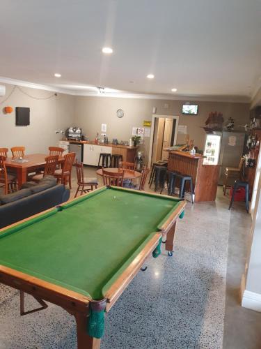 a living room with a pool table in it at Koromatua Homestead in Whatawhata