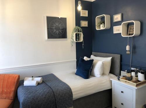 Ένα ή περισσότερα κρεβάτια σε δωμάτιο στο Cloves Boutique Bed & Breakfast