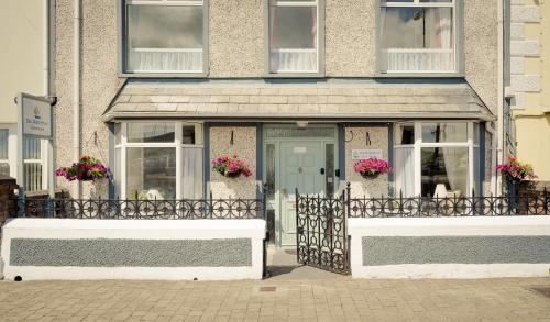 a house with a gate in front of it at The Waterfront in Dingle