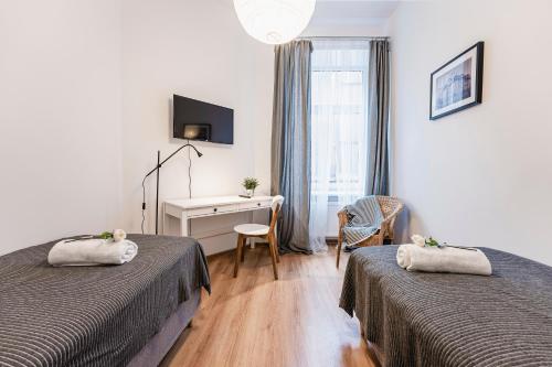 Ένα ή περισσότερα κρεβάτια σε δωμάτιο στο Apartamenty Polonia