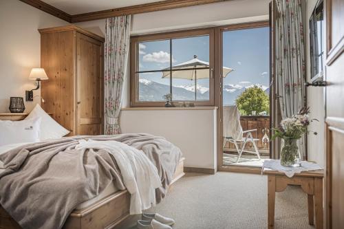 A bed or beds in a room at Aparthotel Stacherhof