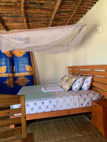 Postel nebo postele na pokoji v ubytování Nanano Beach Home Stay