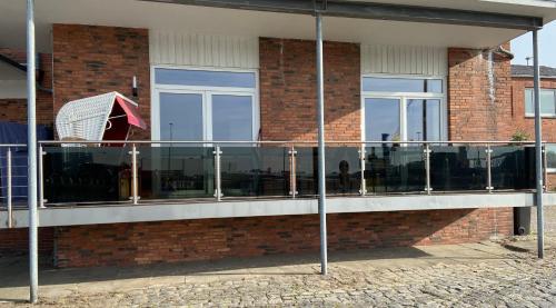 a building with glass windows on the side of it at Atelier Achtung Ausblick! in Rendsburg