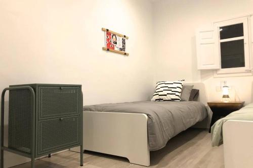 Llit o llits en una habitació de M5 Cool Terrace. Metro 1 min. Center 15' by metro
