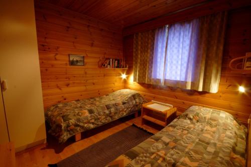 Lova arba lovos apgyvendinimo įstaigoje Jeris Lakeside Resort Cabins