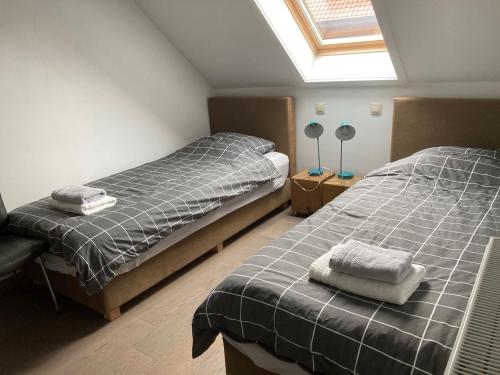 Una cama o camas en una habitación de Kunstmin
