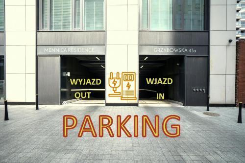 a sign that sayspainted out in front of a building at VipWarsawApartments Onyx Mennica Residence in Warsaw