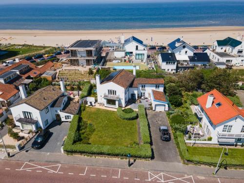 an aerial view of a houses and the beach at Family Villa behind the Beach in Zandvoort