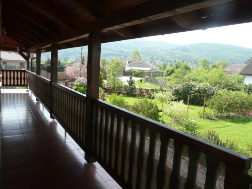 a balcony with a view of a garden at Penzion U Tulaka in Dobřichovice