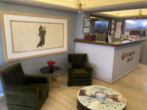 a waiting room with two chairs and a table at Olimpia Hotel in Fethiye