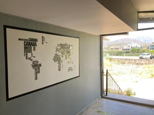 a wall with a picture of a map on it at Olimpia Hotel in Fethiye