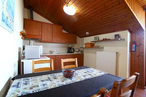 A kitchen or kitchenette at PanoramaLoft - quality, view, sea & mountain