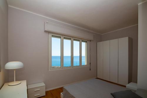 Posteľ alebo postele v izbe v ubytovaní Casa Baia Blu