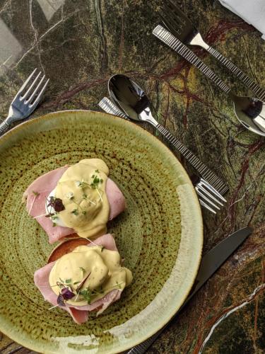 a plate of food with meat and sauce on it at Isle Of Mull Hotel and Spa in Craignure