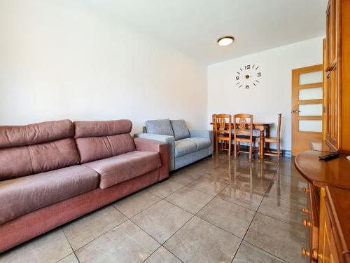 a living room with a couch and a table at Apartamento Completo Torresol I in Benidorm
