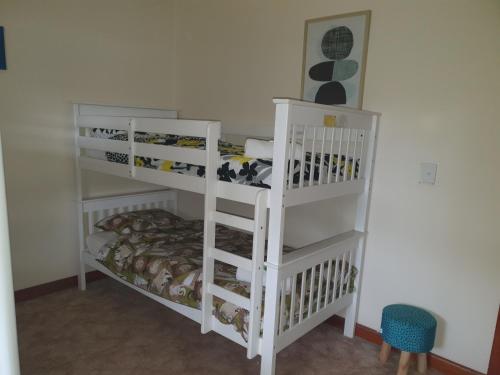 A bunk bed or bunk beds in a room at " Just like Nanna's "