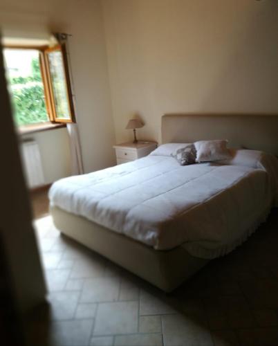 Postel nebo postele na pokoji v ubytování Residence La Pineta