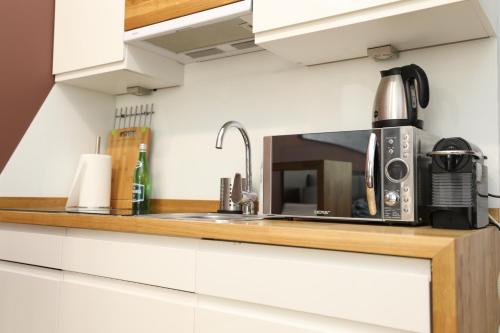Kuchyňa alebo kuchynka v ubytovaní Coffee Apartments Espresso 6C