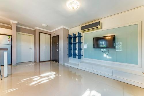 a large living room with a tv on a wall at VISTA Villa in Belek