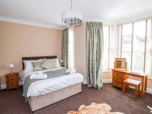 a bedroom with a bed and a large window at Oakhurst in Keswick