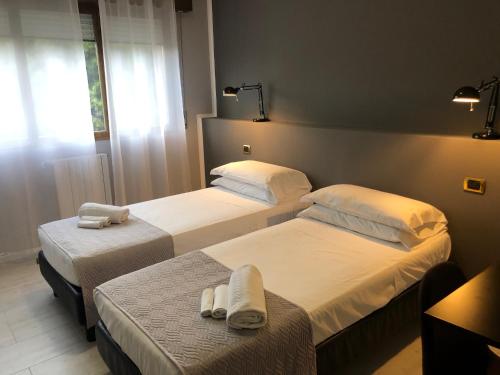 Posteľ alebo postele v izbe v ubytovaní Hp Fly Hotel Bologna