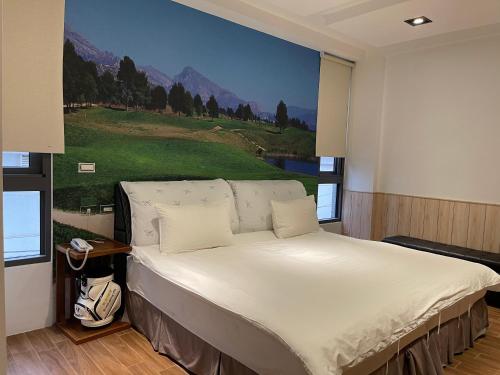 Postel nebo postele na pokoji v ubytování π 園周綠溫泉會館 Pi Hotspring Resort