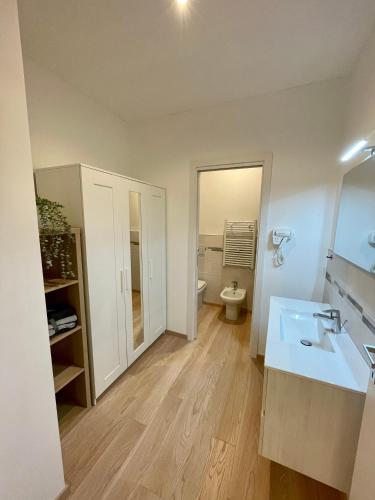 a bathroom with a sink and a toilet at Residence Neverin Luxury Apartments-Private Garage in Trieste