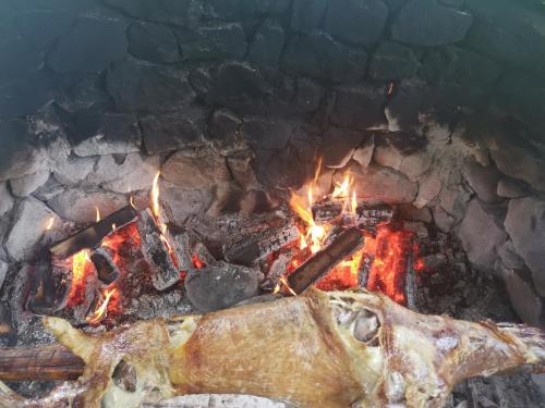 a close up of a fire in a grill at Къща Томови,стаи за гости in Devin
