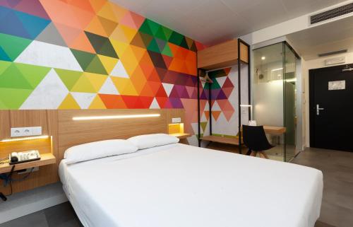Voodi või voodid majutusasutuse Vértice Roomspace toas