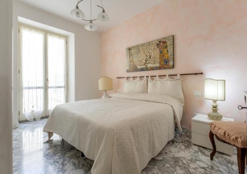 Säng eller sängar i ett rum på Leonardo al Duomo - Bufalini Apartments