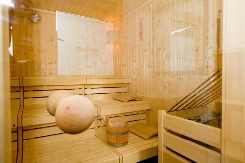 a sauna with a wooden floor and a staircase at Adventure Camp in Oetz