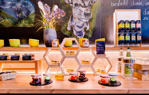 a display of products on a table in a store at Zur Post Kümmersbruck Hotel & Tiny Houses in Kümmersbruck