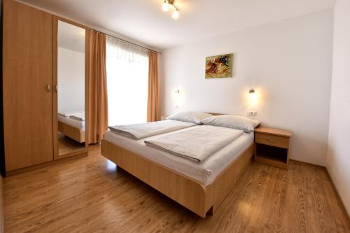 Postel nebo postele na pokoji v ubytování Tomic Apartments